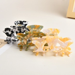 Elegant hollow acetate claw clips with marble texture in various colors for hair styling