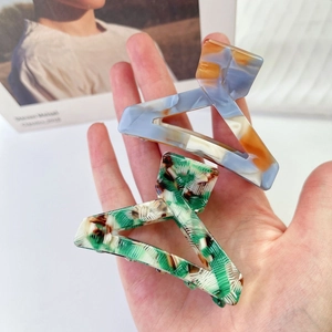 Minimalist marble acetate hair claw clips set in blue, brown and green patterns