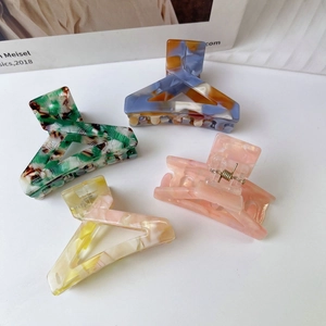 Set of four geometric acetate shark hair claws in marble and solid colors for women