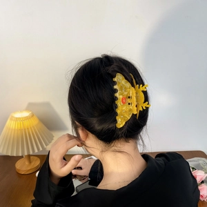 Chic yellow moose hair claw clip made of acetate with rhinestone reindeer design