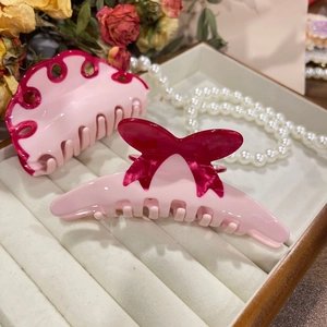 Set aus rosa und tiefroten Acetat-Haarklammern mit Schleife für Damenfrisuren