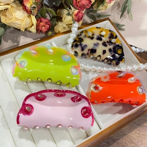 Elegant acetate claw clips set in leopard, green, pink and orange with wave hollow design