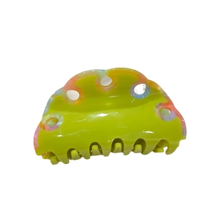 Polished wave hair claw clip in vibrant green with multi-color marbled acetate patterns