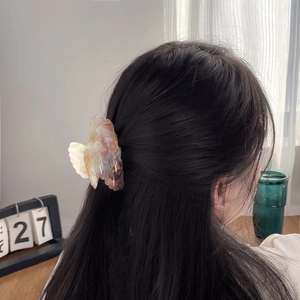 Floral tortoiseshell acetate hair claw clip for thick hair styling in elegant pastel colors