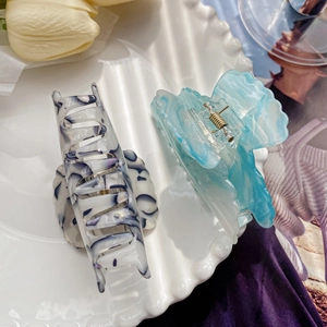 Elegant floral acetate hair claws set with marble and translucent ice blue patterns