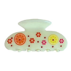 Elegant cream acetate hair claw clip with fruit patterns and sparkling red rhinestones