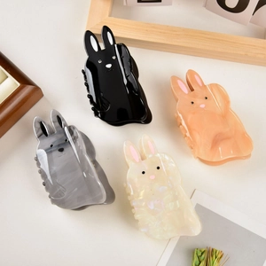 Cute acetate rabbit hair claws in black, orange, grey, and white colors for women