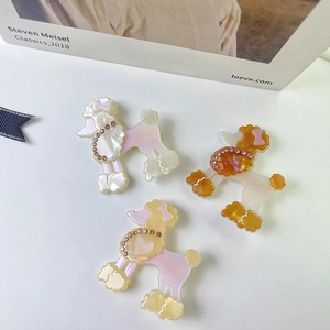 Tres pinzas para el pelo de caniche en acetato con diamantes en rosa, amarillo y marrón