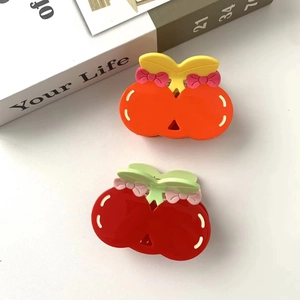 Cute cherry-shaped hair claws with glossy finish and ribbon detail for women and girls