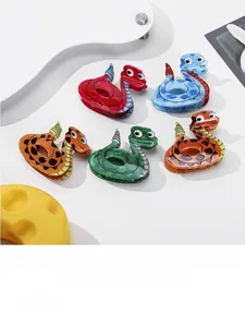 Detailed view of colorful snake-shaped hair claws in red, blue, orange, and green colors