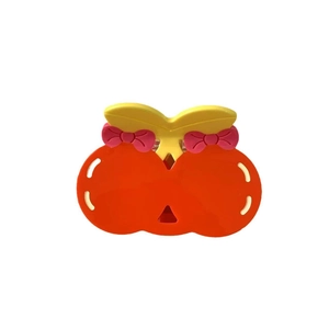 Cute acetate cherry hair claw clip in orange and pink with small decorative bows