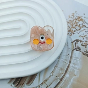 Macro shot of a cute monster hair clip made of pink marble pattern acrylic material