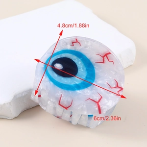 Unique evil eye hair claw clip with blue iris and marble texture for trendy hairstyles