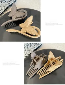Detailed view of matte butterfly hair claws in grey and apricot with sturdy metal springs