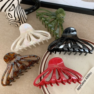 Set of large hollow acetate hair claws in five colors with golden France logo lettering