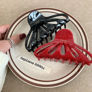 Elegant hollowed petal hair claw set in black and red with gold France Handmade logo