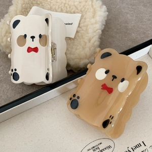 Cute bear-shaped acetate hair claw clips in cream and light brown with red bow design