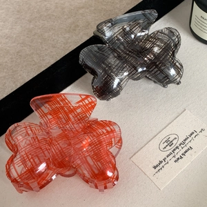 Acrylic checkered bow claw clips set in translucent red and grey for stylish hair styling
