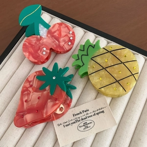 Three-piece acetate fruit hair claw set featuring cherry strawberry and pineapple designs
