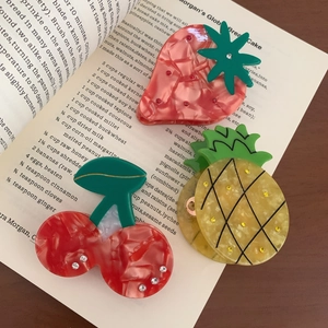 Three-piece acetate fruit hair claws set featuring strawberry pineapple and cherry designs