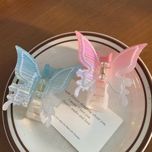 Pince à cheveux papillon élégante avec perles et fini irisé en rose et bleu