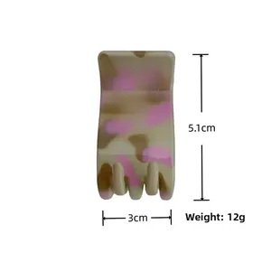 Detailed view of dusty pink shark hair claw clip with dimensions 5.1cm by 3cm and 12g weight