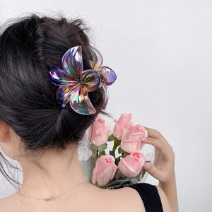 Iridescent plumeria flower hair claw clip in purple aurora finish for women