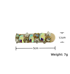 Detail showing dimensions 5cm and 7g weight for rhinestone star hair clip