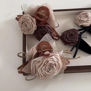 Elegant floral chiffon hair claw clips in beige and brown colors with a linen bow detail