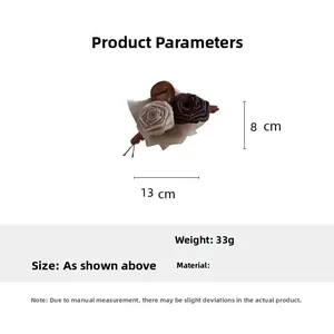 Detail view of 13cm beige and brown fabric rose hair claw clip with size specifications