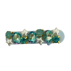 Elegant blue rhinestone hair clip with star pearls and sparkling gems on a white background