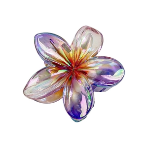 Iridescent plumeria flower hair claw clip with colorful laser finish for beach vacation