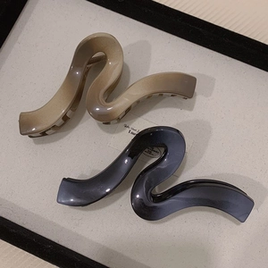Minimalist large wave hair claw clips in khaki and grey gradient finish for elegant styling