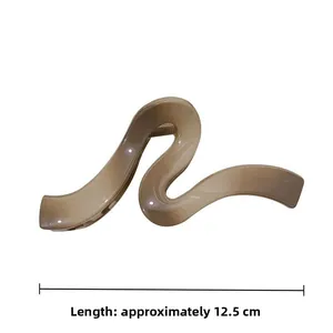 Large wave hair claw clip in beige resin, measuring approximately 12.5cm in length