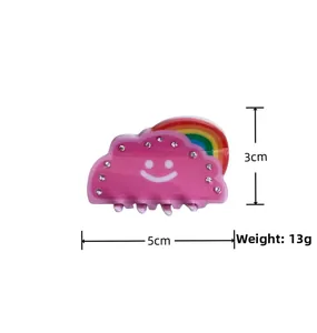 Détail pince à cheveux nuage rose avec smiley, strass et accent arc-en-ciel 5cm