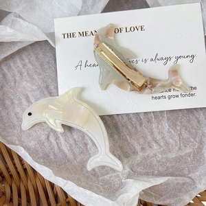 Chic dolphin acetate hair clips in cream white and tortoise shell with metal duckbill base