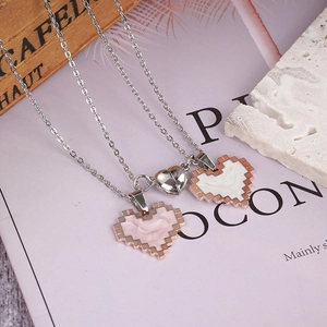 Magnetic heart pendant necklaces for couples featuring pixel mosaic design in rose gold finish