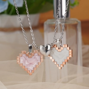 Magnetic couples necklace set with pixel heart pendants in pink and white enamel