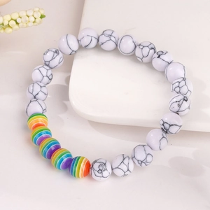 Rainbow beaded friendship bracelet with white turquoise style stones and elastic cord