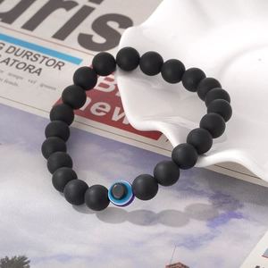 Bracelet en perles de pierre noire mate avec breloque œil bleu pour hommes et femmes