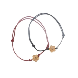 Handcrafted red and black braided rope bracelets with carved peach wood plum blossom charms