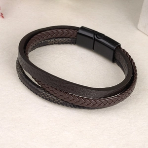 Men's multilayer leather bracelet with braided strands and black magnetic clasp