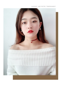 Elegant retro choker set with red heart pendant and pearl earrings on female model