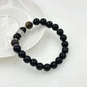 Bracciale da uomo in pietra lavica nera con occhio di tigre e perline in argento