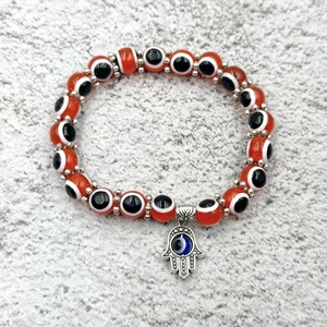 Bracciale etnico con perline Evil Eye arancioni e ciondolo mano di Hamsa argento