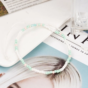 Bohemian handmade beaded hoop earrings with mint green, white, and pink beads for women