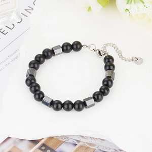 Detail of 8mm tiger eye bead bracelet with magnetic stones and stainless steel clasp