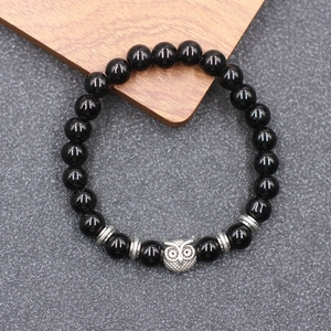 Bracelet de yoga ethnique en perles turquoises et noires avec breloques hibou en argent