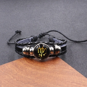 Vintage woven leather bracelet featuring a golden Virgo zodiac sign and adjustable drawstring