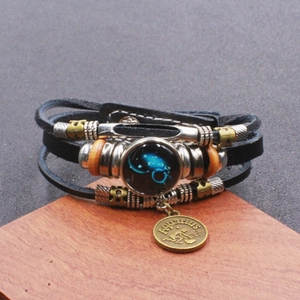 Bracciale Acquario vintage in pelle multistrato con trecce e ciondolo zodiacale in vetro